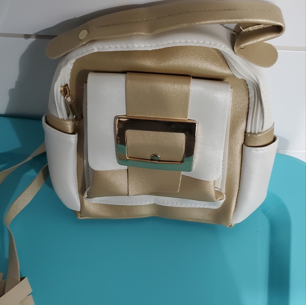 Chic Gold and White Backpack with Smooth Material and Adjustable Strap